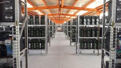 Aerial view of a mining farm with multiple machines.