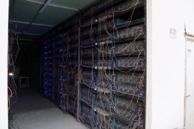Industrial-scale mining farm with rows of high-efficiency mining rigs