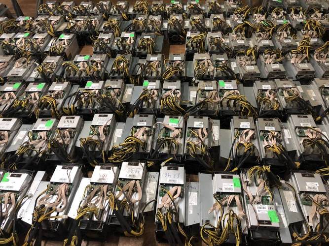 Close-up of a cutting-edge mining rig's internal components such as GPUs and cooling systems